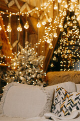 Blurred warm Christmas lights creating a festive bokeh effect against a wooden background. Holiday decoration concept for seasonal celebration.