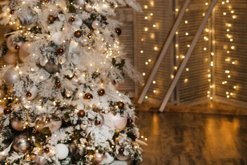 Decorated Christmas tree with shimmering lights and ornaments in a festive winter wonderland setting. Holiday warmth for New Year celebration.