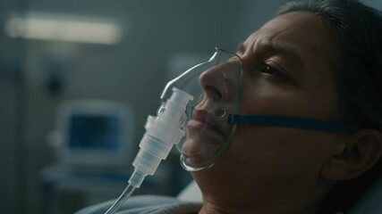 Senior woman with oxygen mask in hospital bed during recovery, medical treatment and care in a clinic - Powered by Adobe