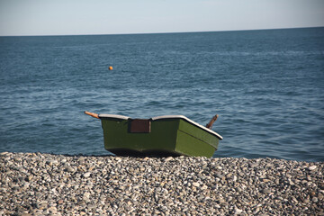 a wooden boat on the seashore