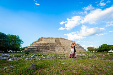 Tourist couple in Izamal pyramids Mexico