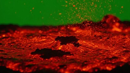 Fiery molten lava erupting and flowing powerfully against vibrant green backdrop, showcasing nature's raw energy and dynamic geological processes