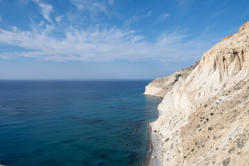 Fototapeta premium Rocky coastline ocean water. White cliffs and pebble beach. Pissouri Limassol Cyprus