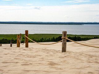 View from the moving dune onto the meadow of Lake Lebsko in the Slowinski National Park.