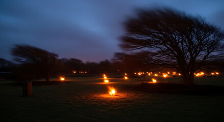 Field illuminated with numerous small fires under a dark sky with trees silhouetted against the horizon ai generated