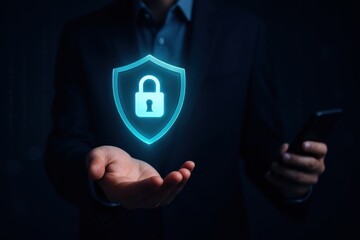 Businessman holding smartphone with glowing holographic shield lock icon representing cybersecurity, data protection and online privacy
