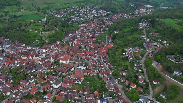 Aerial around the city Weingarten 76356 in Germany on a cloudy spring day.