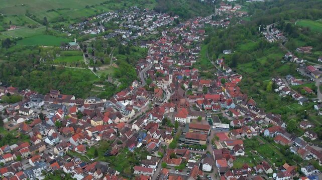 Aerial around the city Weingarten 76356 in Germany on a cloudy spring day.