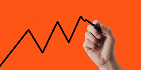 A person's hand uses a black marker to draw an upward trending line graph, symbolizing business growth, financial success, and positive data analytics