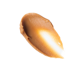 Smear of condensed milk close-up. Trace of caramel paste on a transparent background