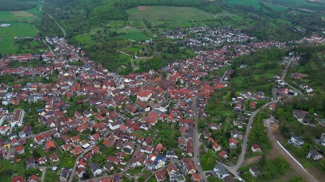 Aerial around the city Weingarten 76356 in Germany on a cloudy spring day.