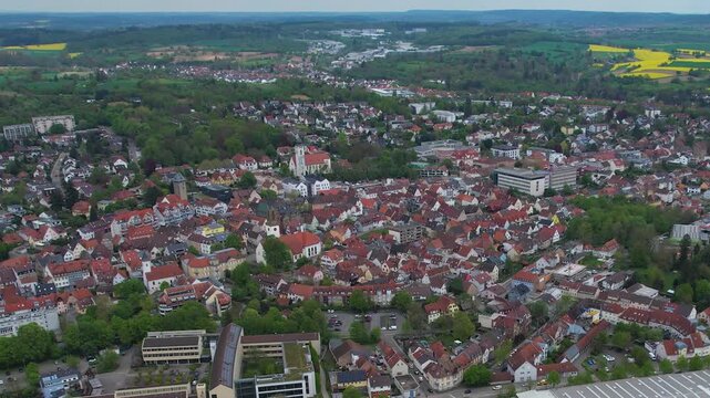 Aerial around the city bretten in Germany on a cloudy spring day.