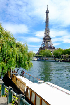 Paris, France, Europe. View of the Eiffel Tower along the banks of the Seine in the summer. 