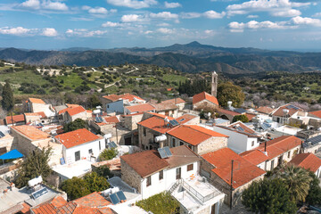 Obraz premium Kato Lefkara village houses with mountains and church bell tower. Cyprus