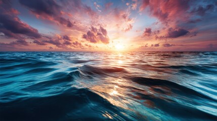 Obraz premium A breathtaking sunset over calm ocean waters illuminates the sky with vibrant colors, creating a serene and picturesque scene that embodies tranquility and natural beauty.