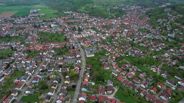 Aerial around the city Weingarten 76356 in Germany on a cloudy spring day.