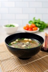 miso soup in black bowl	