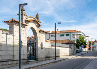 Cobblestone road entering a traditional portuguese town