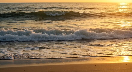 Obraz premium Golden sunlight illuminates ocean waves and sandy beach at dusk