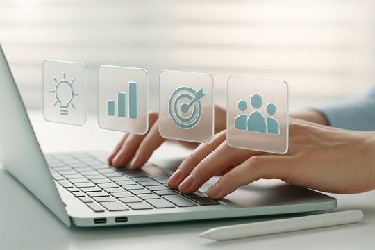 Hands typing on laptop keyboard with holographic icons of idea growth target and people teamwork
