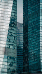 mirrored windows of the facade of an office building