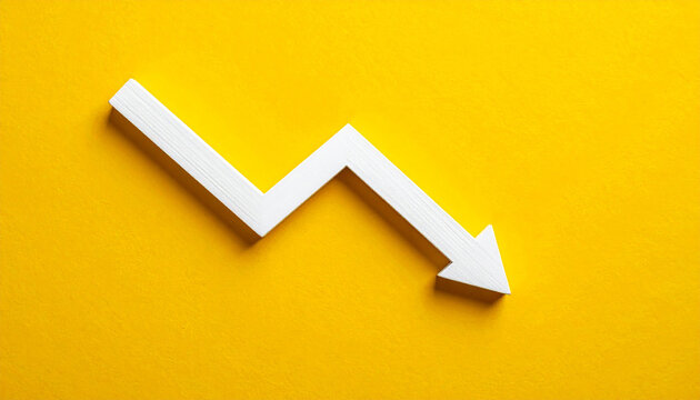 White wooden arrow pointing downward, yellow background, market decline or economic downturn