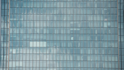 mirrored windows of the facade of an office building