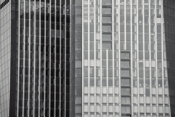 mirrored windows of the facade of an office building