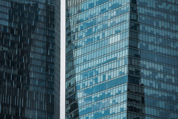 mirrored windows of the facade of an office building