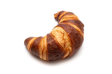 Classic French croissant isolated on a white background