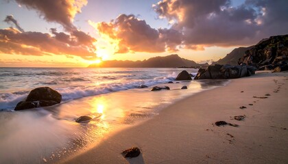 A tranquil beach scene at sunset, showcasing soft waves lapping at the shore, with warm golden hues painting the sky and the sand, and dark rocks creating a sense of serenity.