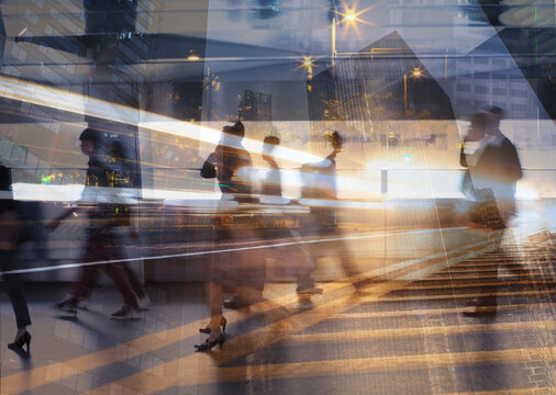 Busy city street with motion blur of people walking, fast pace lifestyle, blurred motion abstract lights 
