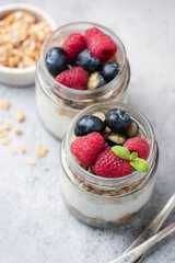 Healthy dessert for fitness and weightloss lifestyle: parfait with greek yogurt, granola, raspberries and blueberries