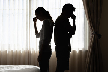 Couple back facing each other in a stressful relationship disagreement argument  