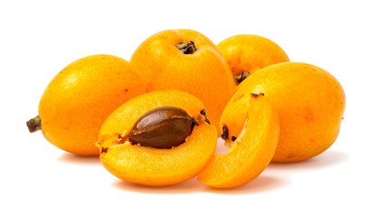 Fresh, vibrant loquats, whole and sliced, display a bright, golden yellow color against a crisp white background.
