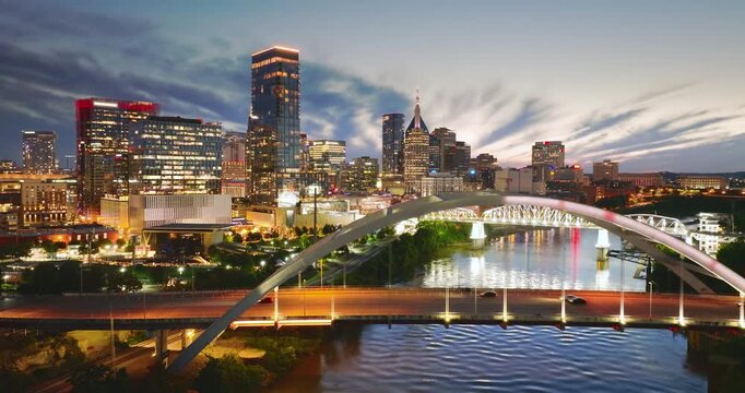 Highway traffic with driving cars on Korean Veterans Memorial Bridge in downtown district of Nashville city in Tennessee, USA.