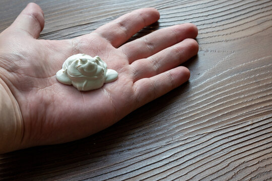 Young Man’s Hand with Applied Moisturizing Cream