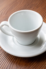 Close-Up of a White Coffee Cup on a Brown Table
