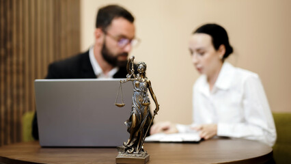 A lawyer and an attorney discuss the contract. A successful businessman reviews the agreement. Concept of business deal and legal consultation.