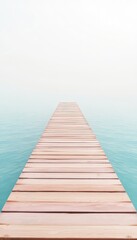 Obraz premium Wooden platform leading into the tranquil, aqua blue water, creating a peaceful feeling and inviting contemplation and a journey.