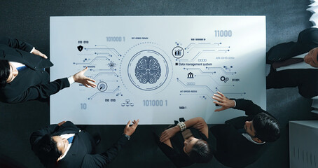 A dynamic business team collaborates on innovative data management strategies, analyzing technology graphics in a modern office setting to enhance productivity and creativity. Trope