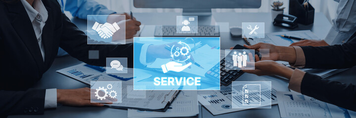 Business professionals collaborate in a modern office setting, emphasizing teamwork and digital...