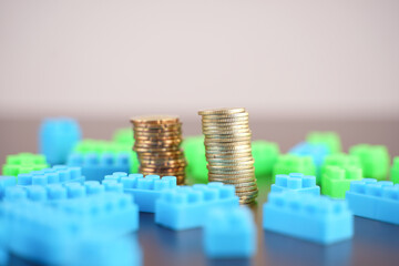 coins with plastics block for conceptual photo for business planner 