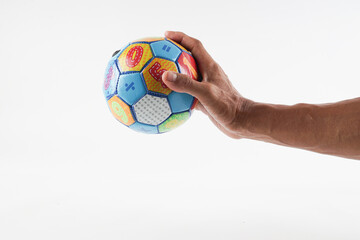hand holding soccer ball