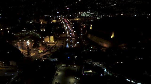 Night Aerial View of Skopje: Highway Traffic, City Lights, and Kale Fortress