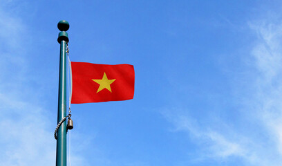 High-quality vietnam national flag flag waving on a pole against a clear - Symbol of culture, heritage, and patriotism