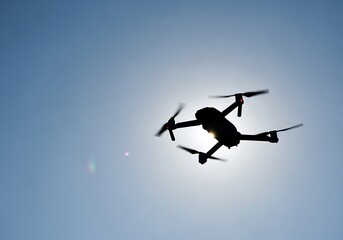Fototapeta premium Drone in Flight Against a Clear Sky.