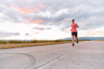 Determined Athlete Running in the Sun amidst Beautiful Nature