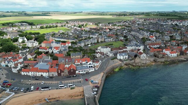 Stunning Aerial Drone Footage of the Aberdour Coastline in Scotland, Scenic Seaside Landscape with Rocky Cliffs, Blue Ocean Waves and Picturesque Coastal Views, Travel and Nature Background Video