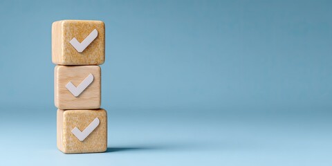 Three light beige wooden blocks stacked vertically, each displaying a white checkmark